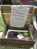 Old fruit crate with sheet music