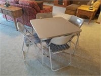 Folding table with four chairs