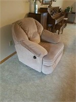 Light brown swivel rocker recliner