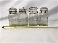 Four Foster Sealfast glass top jars.