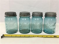 Four Mason jars.