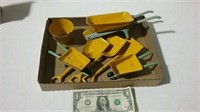 Vintage toy metal wheelbarrows,shovels and a pail