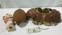 Vintage sized shoulder pads and helmet along with