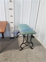 Wrought iron footed bench w/ padded seat