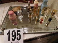 Mirrored vanity tray with perfume bottles and