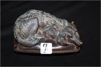 Antique Bronze Dog Sculpture on Bed