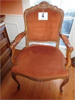 Early upholstered arm chair with brass tacks