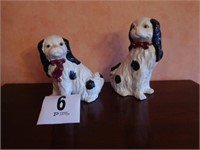 Pair of black and white dog figurines