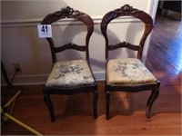 Pair of chairs with rose carved backs and