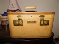 Three vintage Sears suitcases