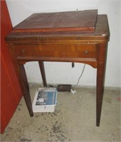 Vintage Singer sewing machine with cabinet and
