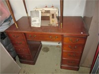 Vintage Singer sewing machine with cabinet.
