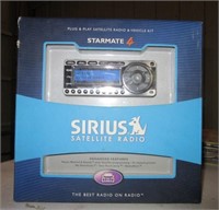 Sirius satellite radio with box.