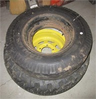 (2) Tires with one tire having a five lug rim.