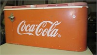 Coca-Cola cooler with bottle opener. Note: Shows