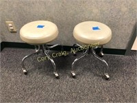 Matching pair of stools on casters