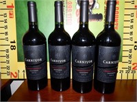 4 "COLLECTIBLE" SEALED CARNIVOR WINE BOTTLES
