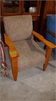 BROWN FABRIC AND WOOD ARM CHAIR