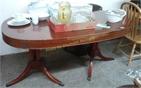 Mahogany oval dining table with pads