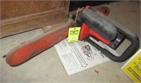 Electric Homelite XE1 chainsaw with manual.
