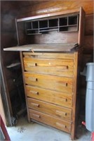 Wood garage cabinet and wood five drawer dresser.