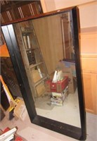 Large heavy wood framed mirror. Measures 50" x