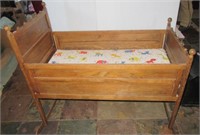 Vintage wood baby cradle. Measures 32" h x 38" w