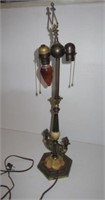 Metal table lamp with ornate design. Measures 26"