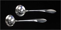 TWO SMALL STERLING SAUCE LADLES.