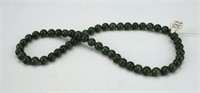 STRAND OF SPINACH GREEN JADE BEADS