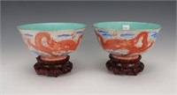 PAIR OF DRAGON BOWLS ON WOODEN STANDS
