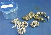Container of brass military buttons mixed with 80
