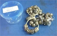 Container of brass military buttons mixed with
