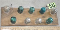 Glass insulators on Oak display