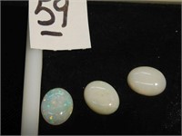 three opal gemstones  -  all three are 7 mm long