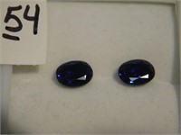 Pair of oval blue sapphire gemstones - both are 6
