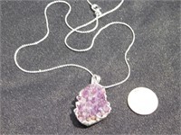 Amethyst crystals wrapped with silver foil
