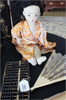 Oriental Cloth Doll and Abacus