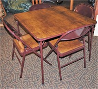 Brown Card Table and 4 Padded Folding Chairs.