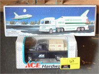 Trucks and space rocket toys in box