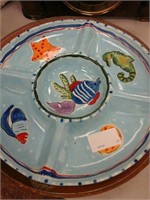 Ceramic plate with fishes on it