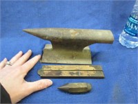 small anvil -plumber bob -folding ruler