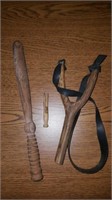 miniature wooden billy club and handmade slingshot