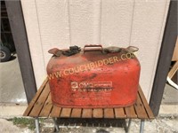 Old red Paint boat motor gas tank