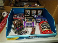 Box of diecast cars and miscellaneous nascar