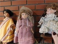 9 Collectible Dolls, 1 Doll Chair