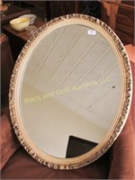 Framed oval mirror, approx 25" by 31"