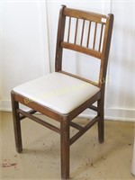 Wooden dining chair with covered seat