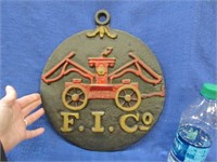 cast iron "F. I. Co" plaque - 11.5 inch diameter