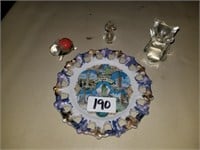 small glass owl, rabbit, & bottle on NYC plate